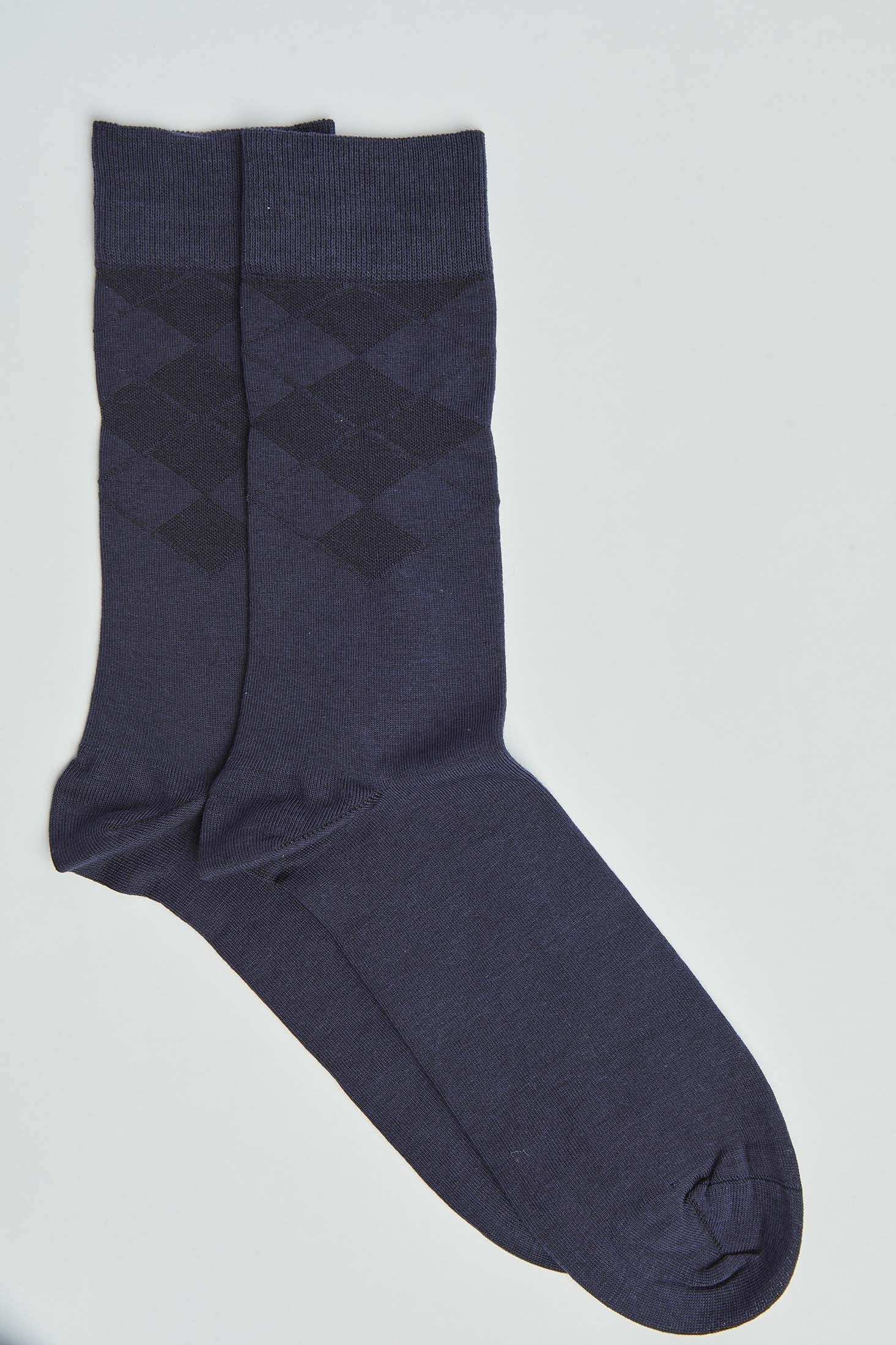 Pair of navy blue socks with subtle diamond pattern on a plain background
