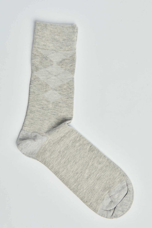 Light grey argyle pattern dress sock on white background, casual men's accessory
