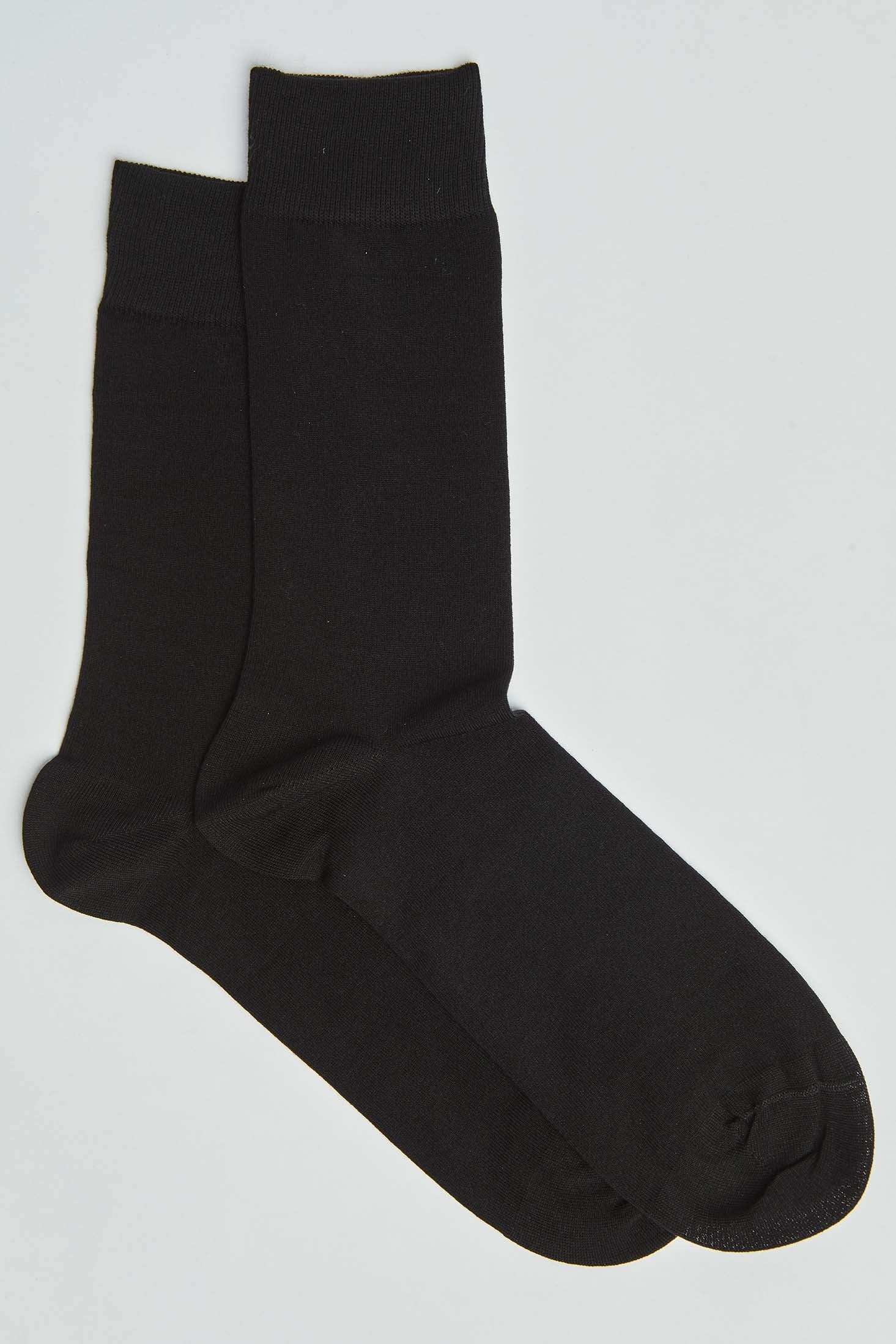 Pair of plain black crew socks on a white background, men's casual accessories