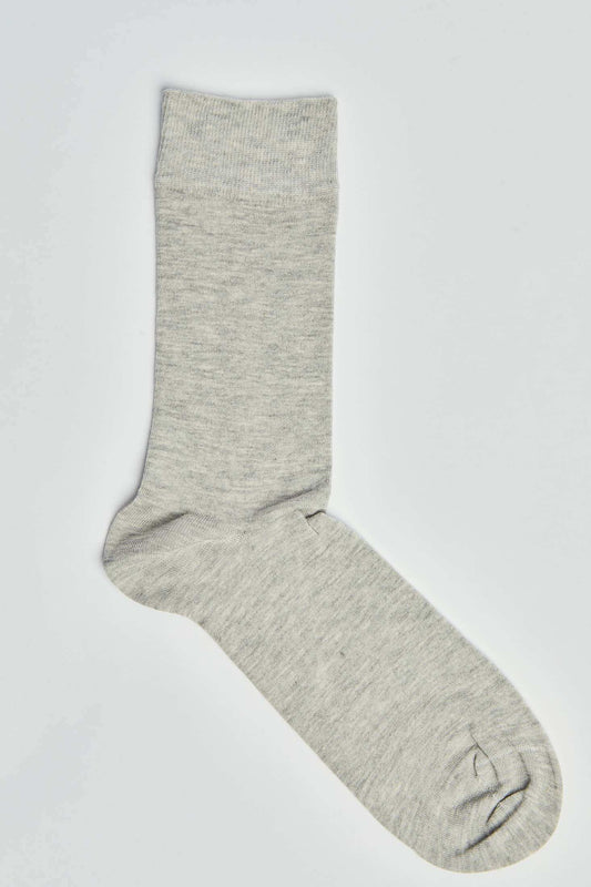 Plain light grey crew sock on white background, casual men’s or women’s hosiery