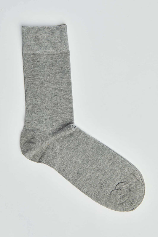 Plain grey men's sock on white background, casual cotton hosiery product photo