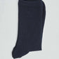 Pair of dark navy ribbed socks on a plain light background