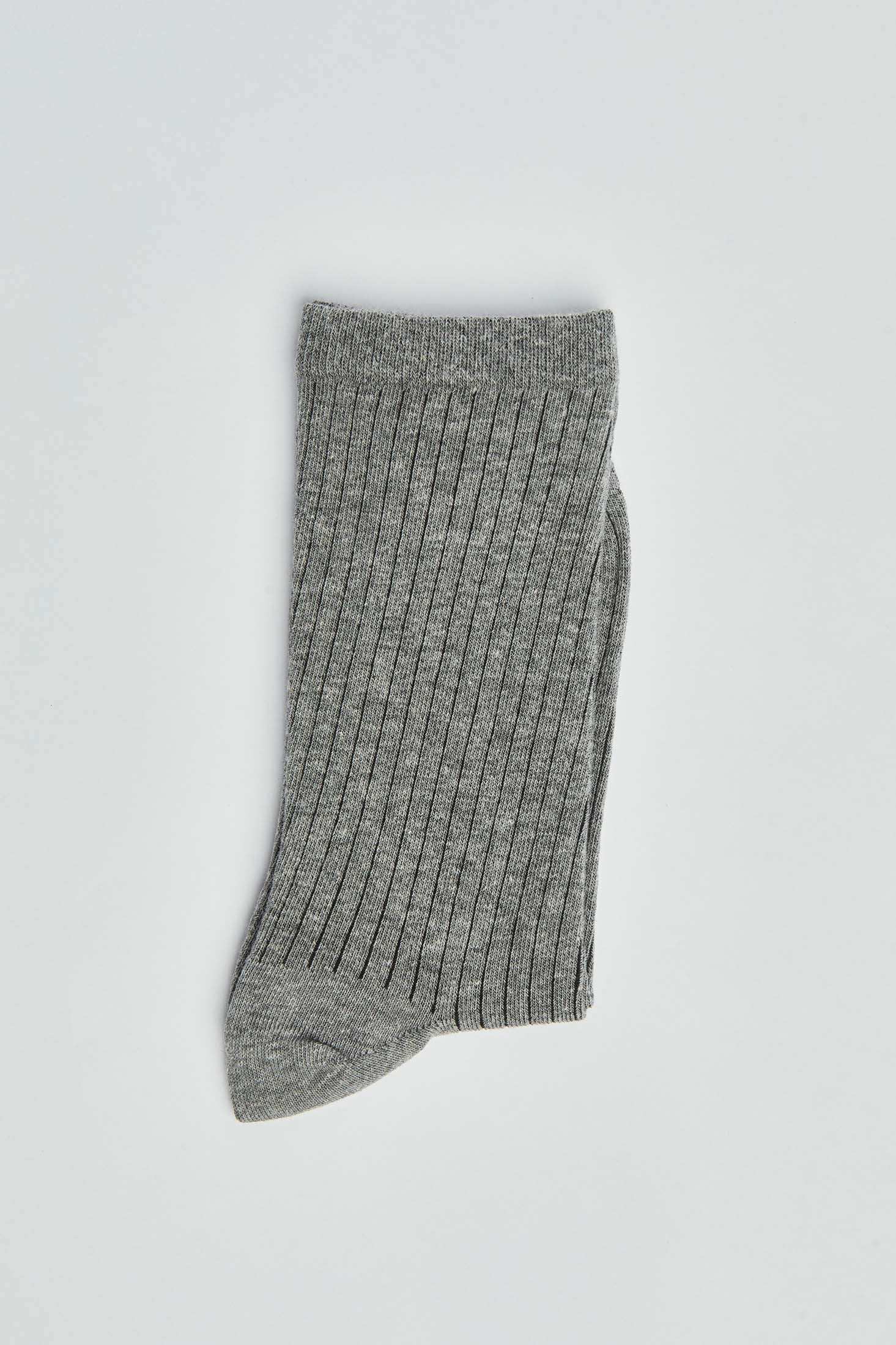 Gray ribbed crew sock folded on white background, casual men's or women's wear accessory