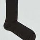 Black cotton crew sock on plain white background, casual men's or women's hosiery