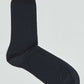 Black men's dress sock laid flat on a white background