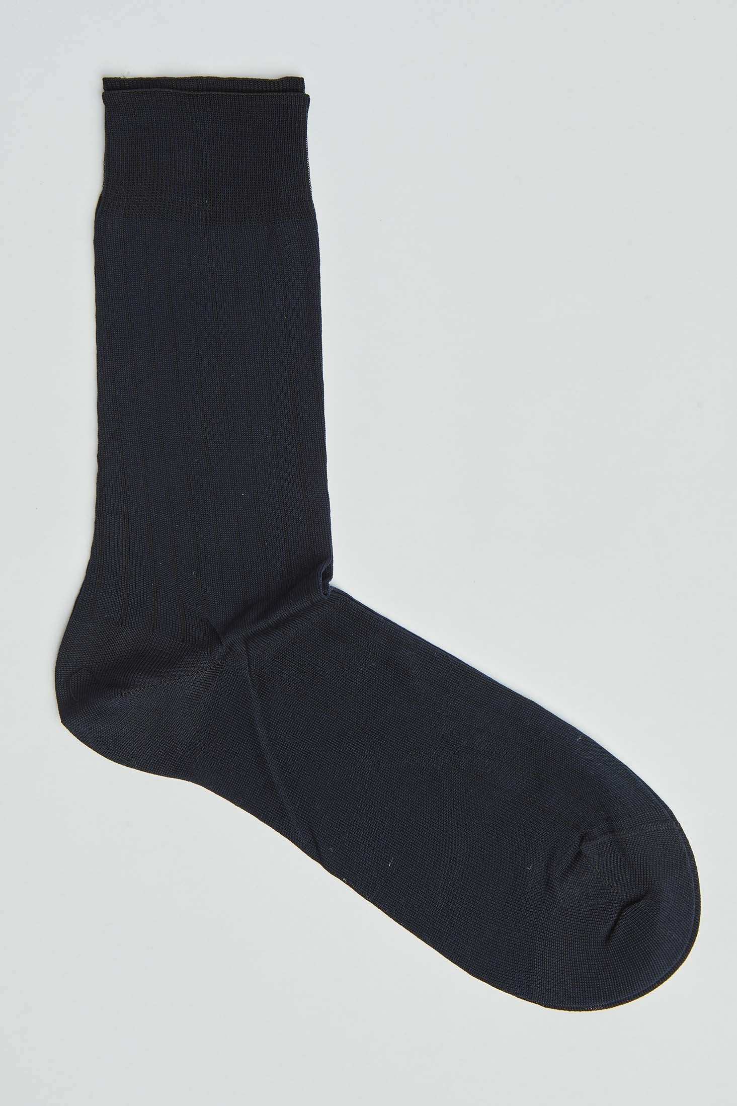 Black men's dress sock laid flat on a white background