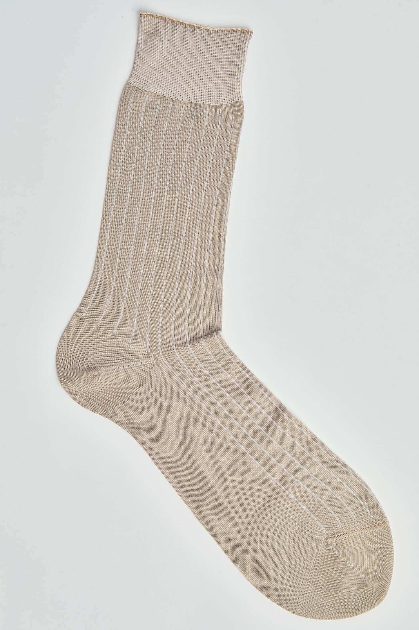Beige ribbed dress sock with thin white stripes on white background
