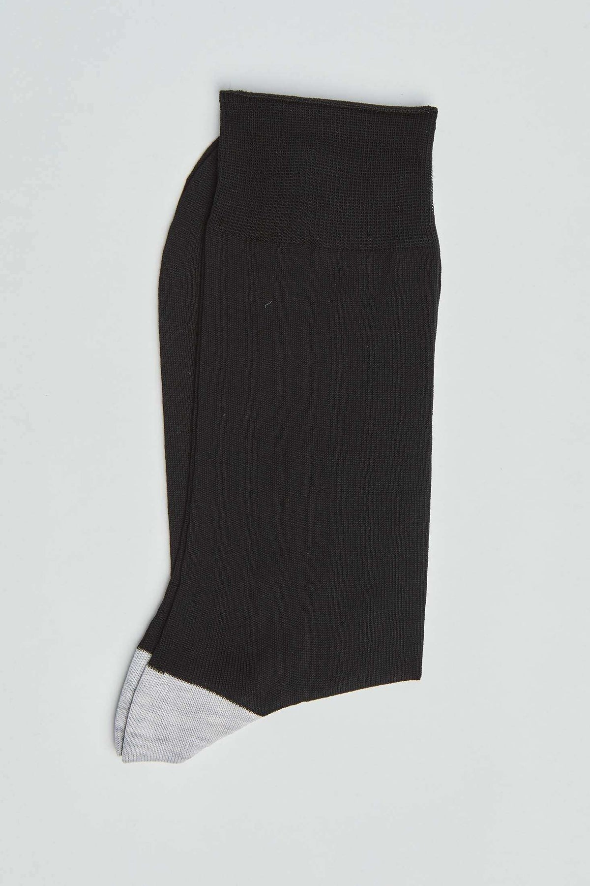 Black ankle sock with grey toe detail on white background, casual men's accessory