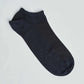 Black ankle sock on plain white background, casual men's and women's footwear