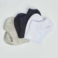 Set of low-cut socks in white, black, and grey on a plain background