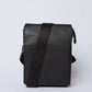Dalydress black leather crossbody bag with adjustable strap on white background