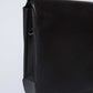 Dalydress black leather crossbody bag with flap, minimalist design on white background