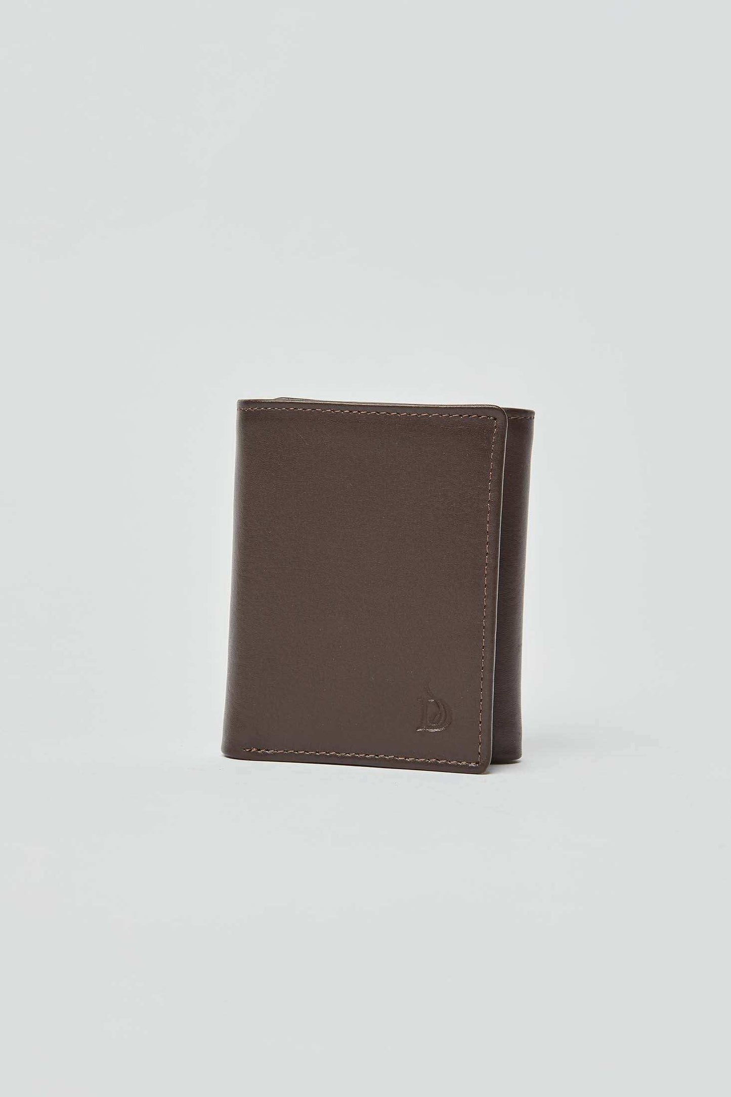 Dalydress brown leather men's wallet with subtle embossed logo on plain background