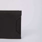 Dalydress black leather men's wallet with textured finish on a light background