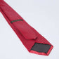 Dalydress red polka dot men's tie on white background, elegant formal accessory