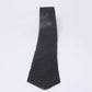 Dalydress men's black tie with small white polka dots on a plain background