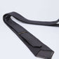 Dalydress black polka dot men's tie on white background, elegant formal wear accessory
