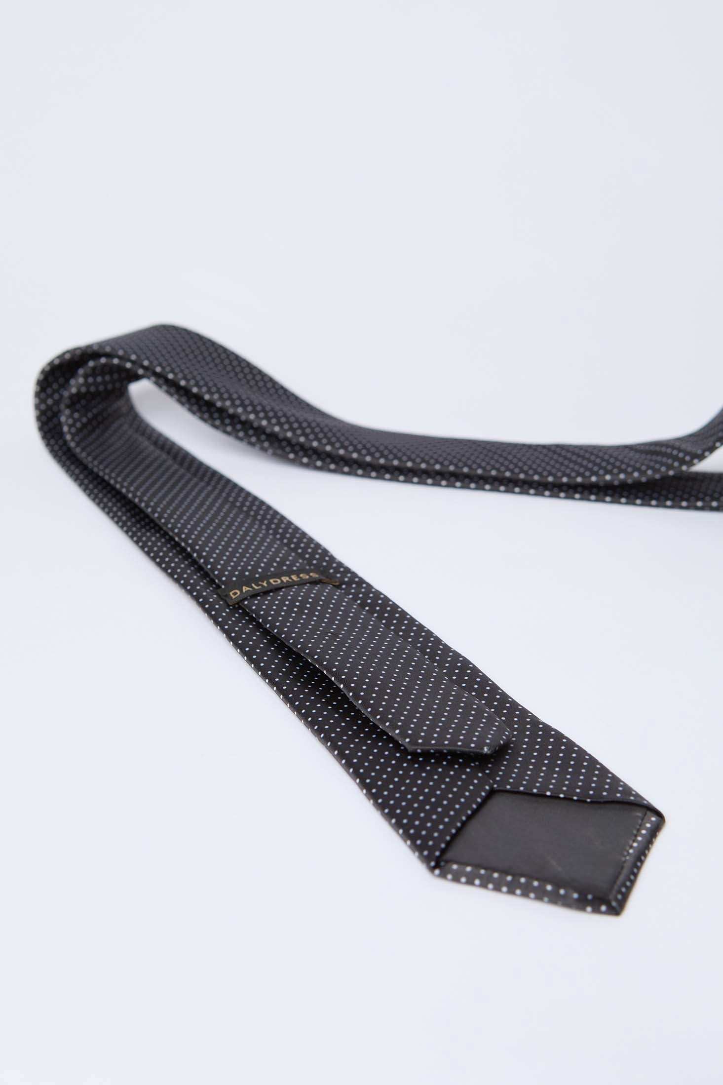 Dalydress black polka dot men's tie on white background, elegant formal wear accessory