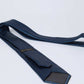 Dalydress blue polka dot men's tie with subtle pattern on white background