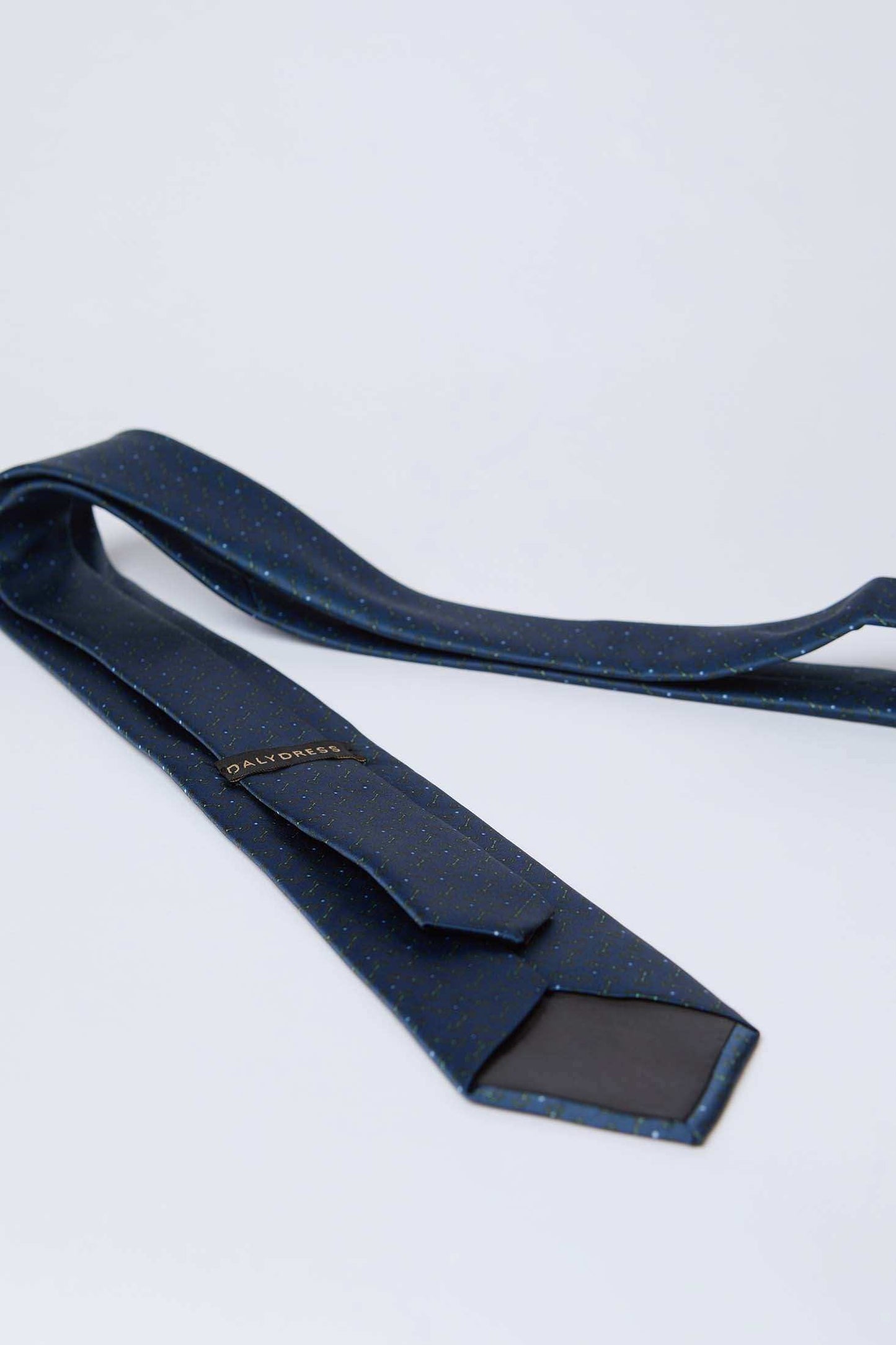 Dalydress blue polka dot men's tie with subtle pattern on white background