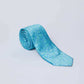 Light blue paisley men's tie from Dalydress, rolled on a plain white background