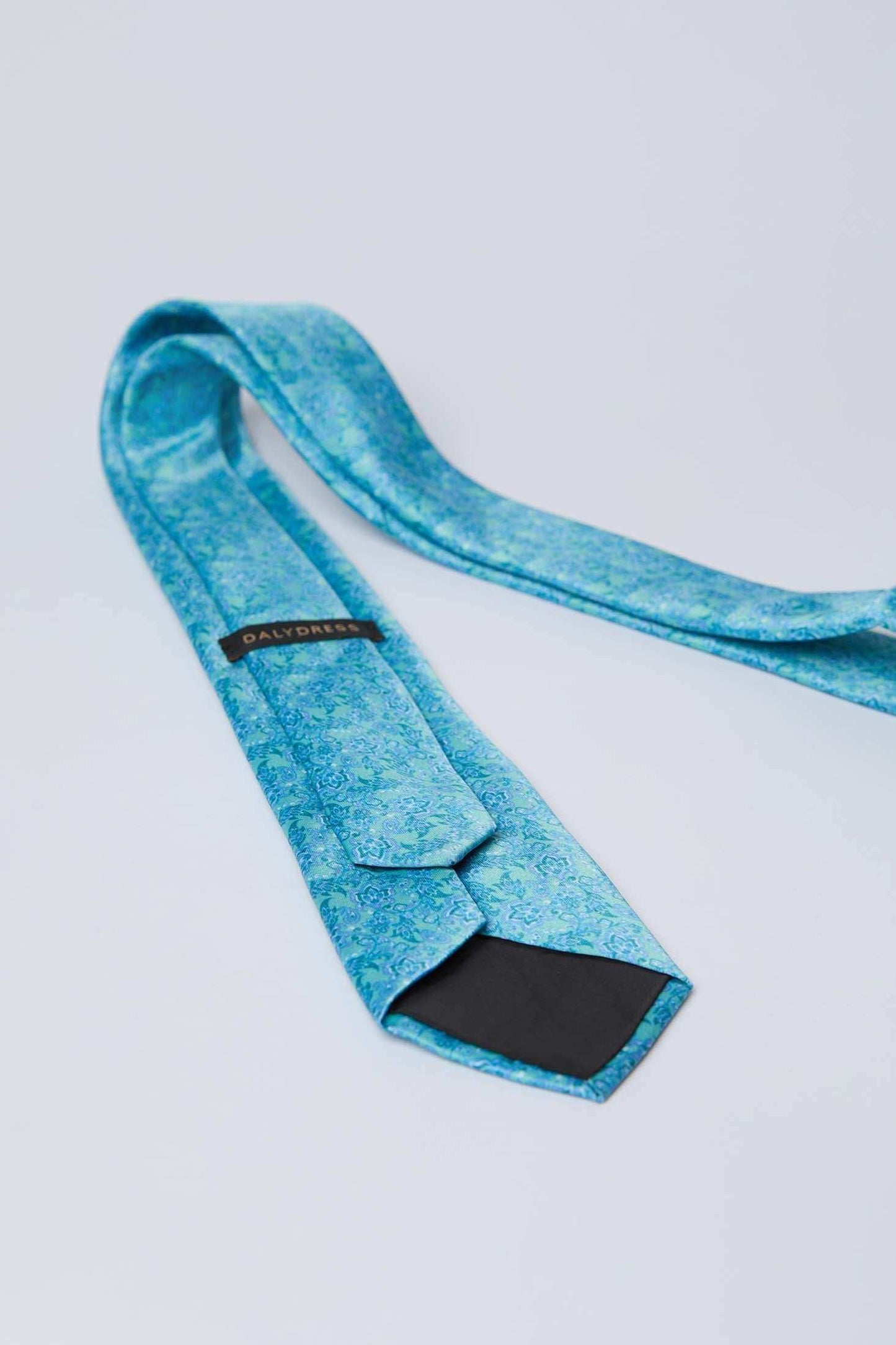 Dalydress blue floral patterned men's tie on white background, elegant accessories