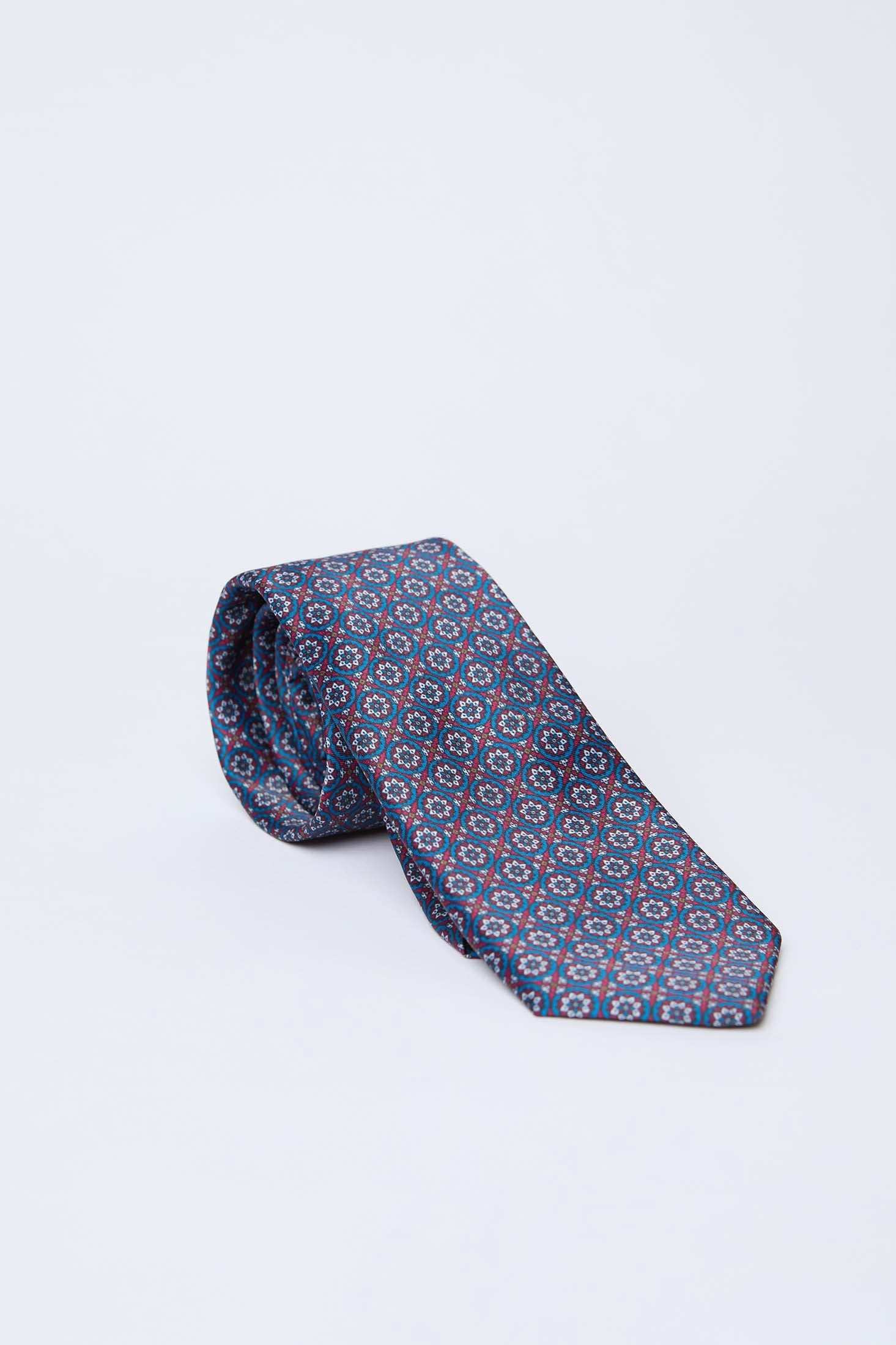 Dalydress patterned blue and red men's tie on white background, elegant Egyptian accessory