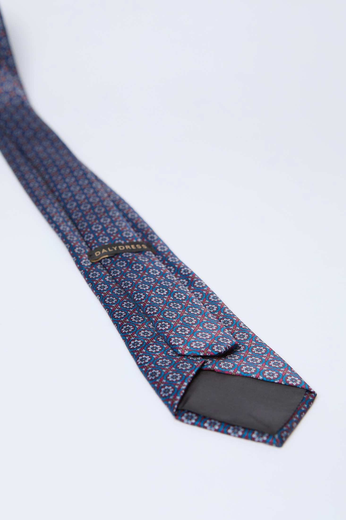 Dalydress men's blue patterned necktie with geometric design on a white background