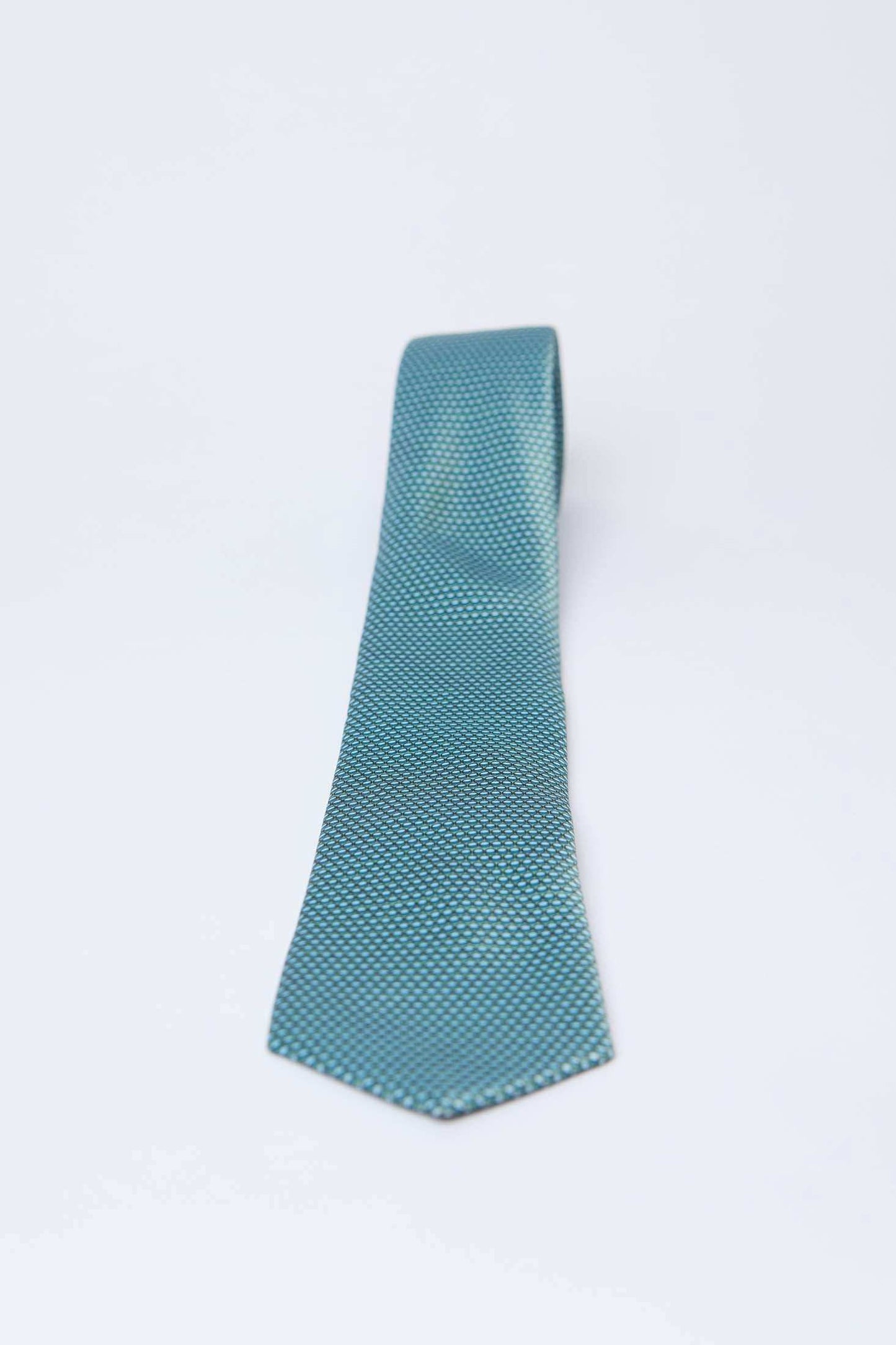 Dalydress men's turquoise textured necktie on white background, Egyptian fashion accessory