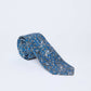 Dalydress men's blue paisley silk tie on white background, elegant formal accessory