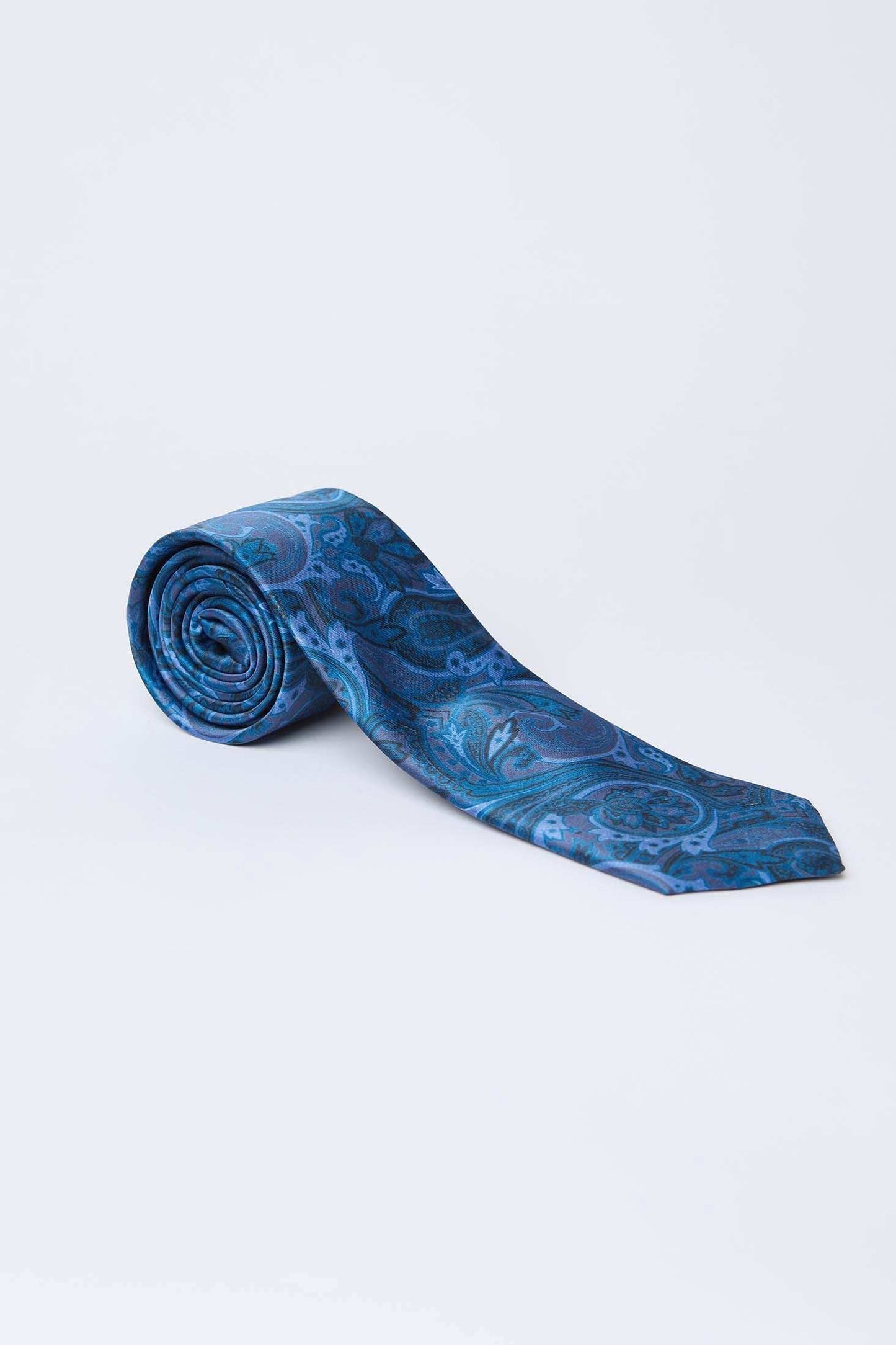 Dalydress men's blue paisley silk tie on white background, elegant formal accessory