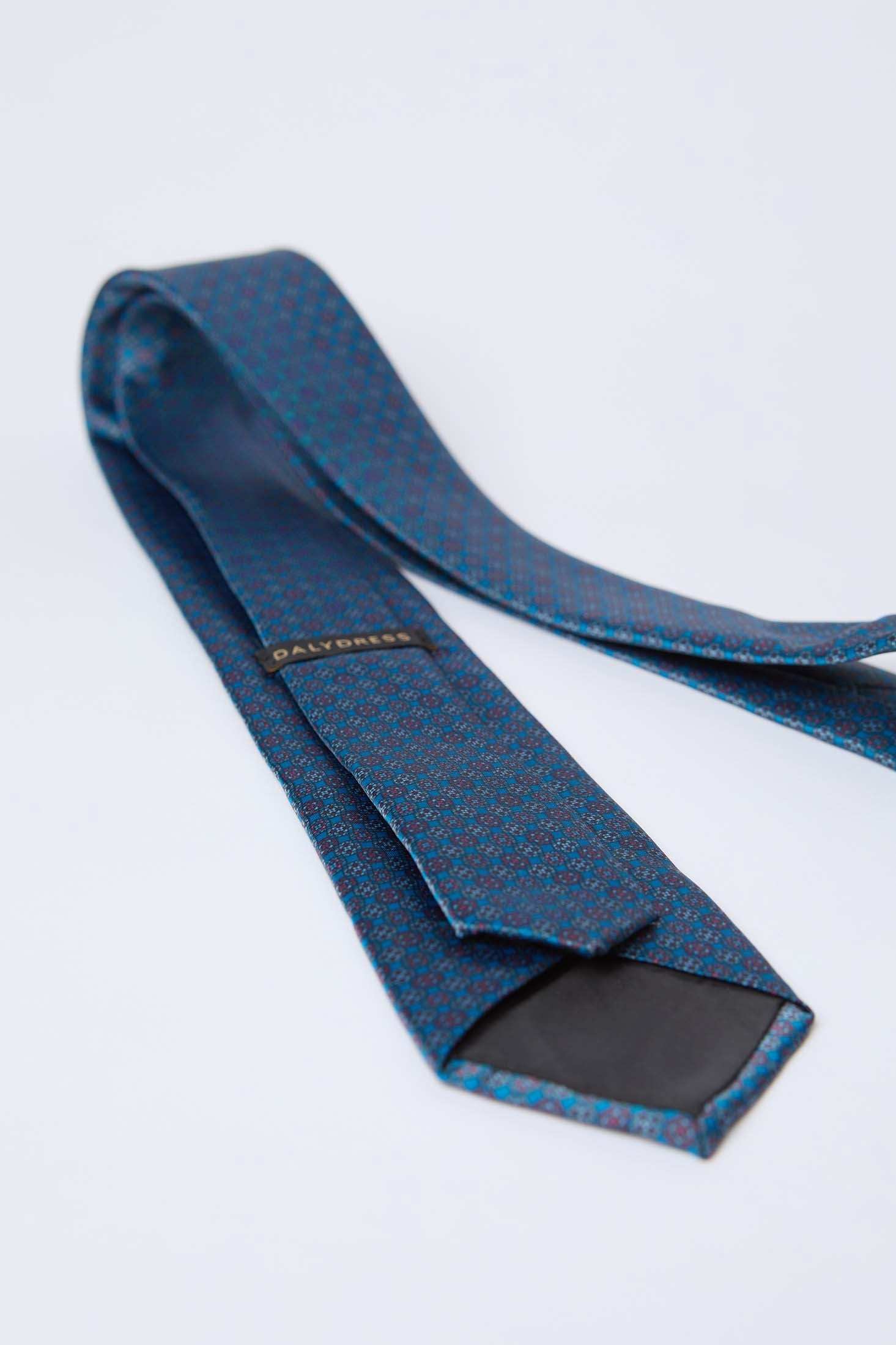 Dalydress men's blue patterned tie with subtle red and blue design on white background