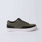 Olive green and black casual sneaker with white rubber sole on plain background