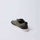 Olive green and black men's casual sneaker with white sole on white background