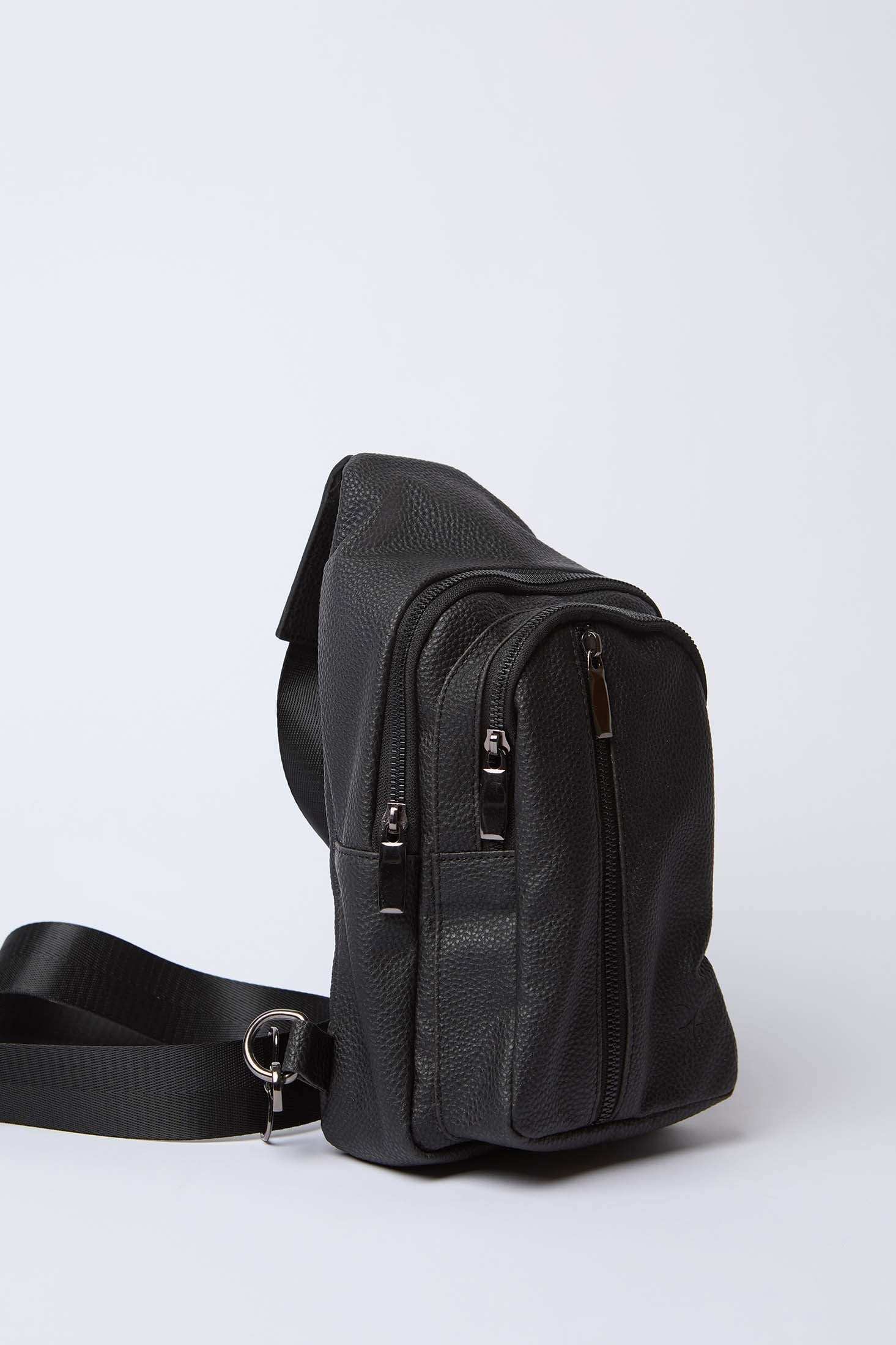 Black leather crossbody bag with multiple zippered pockets and adjustable strap