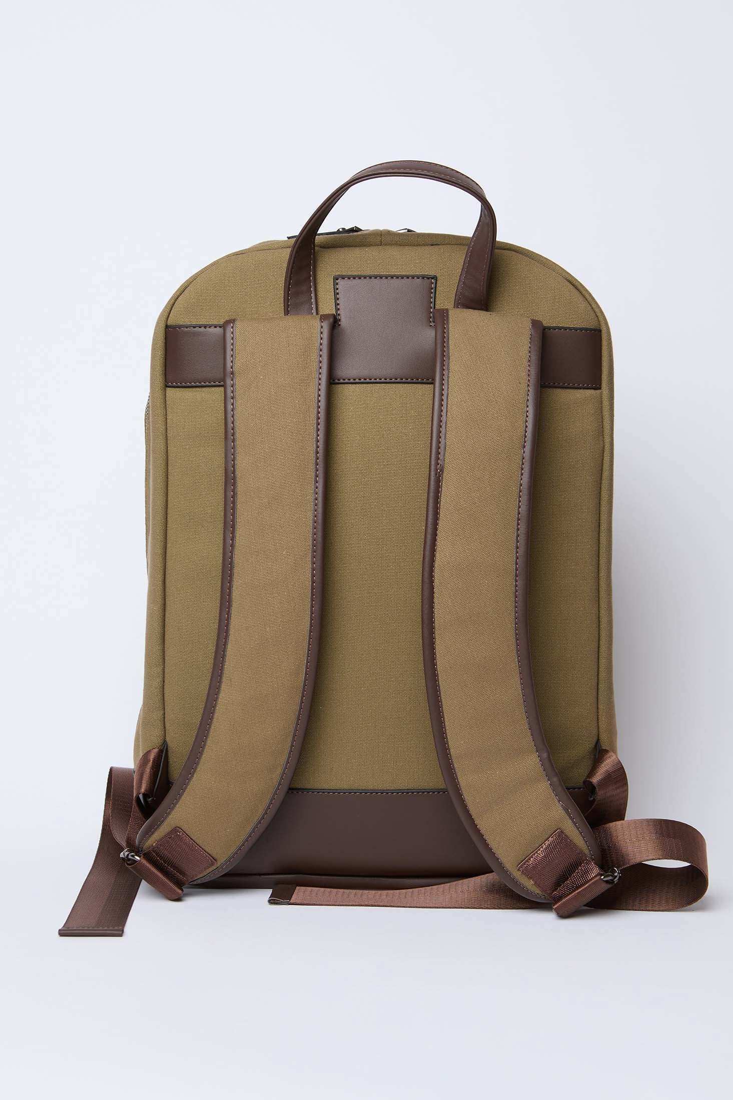 Back view of khaki backpack with brown adjustable straps and leather accents