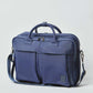 Navy blue men's messenger bag with top handles, dual front pockets, and adjustable shoulder strap