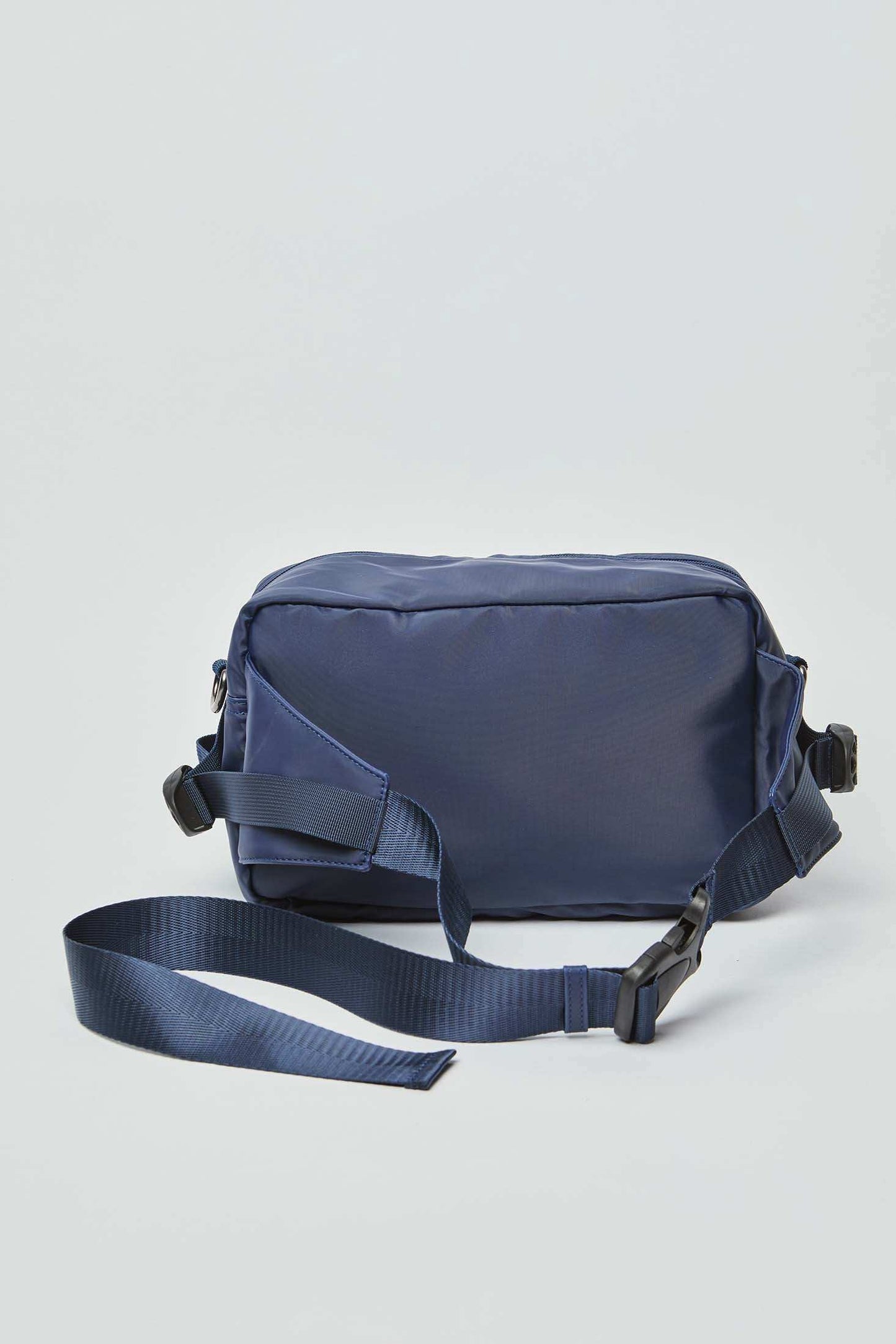 Navy blue crossbody messenger bag with adjustable strap on white background