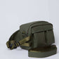 Olive green crossbody bag with two front pockets and adjustable shoulder strap