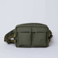 Olive green crossbody bag with front pockets and adjustable strap on white background