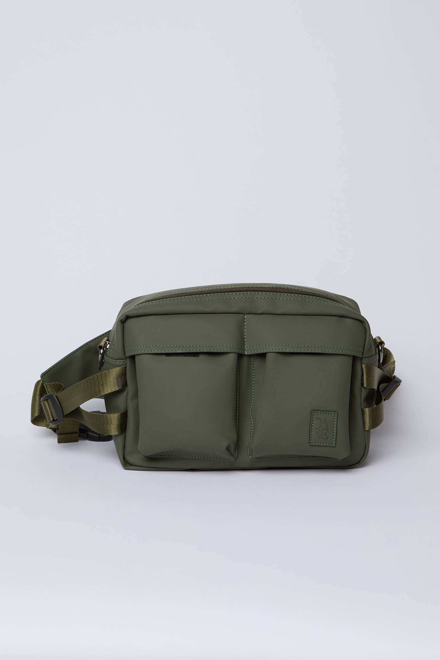 Olive green crossbody bag with front pockets and adjustable strap on white background