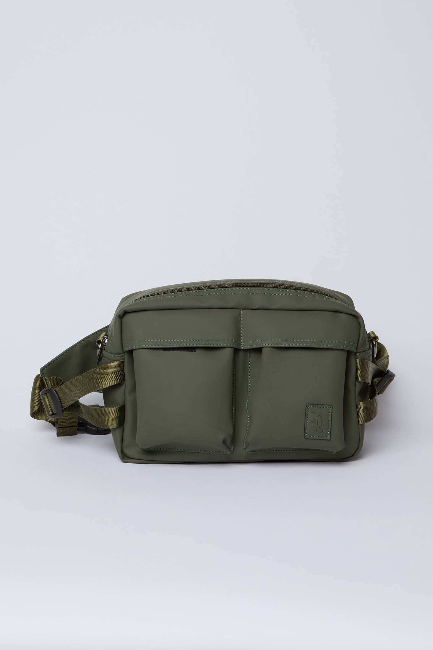 Olive green crossbody bag with front pockets and adjustable strap on white background