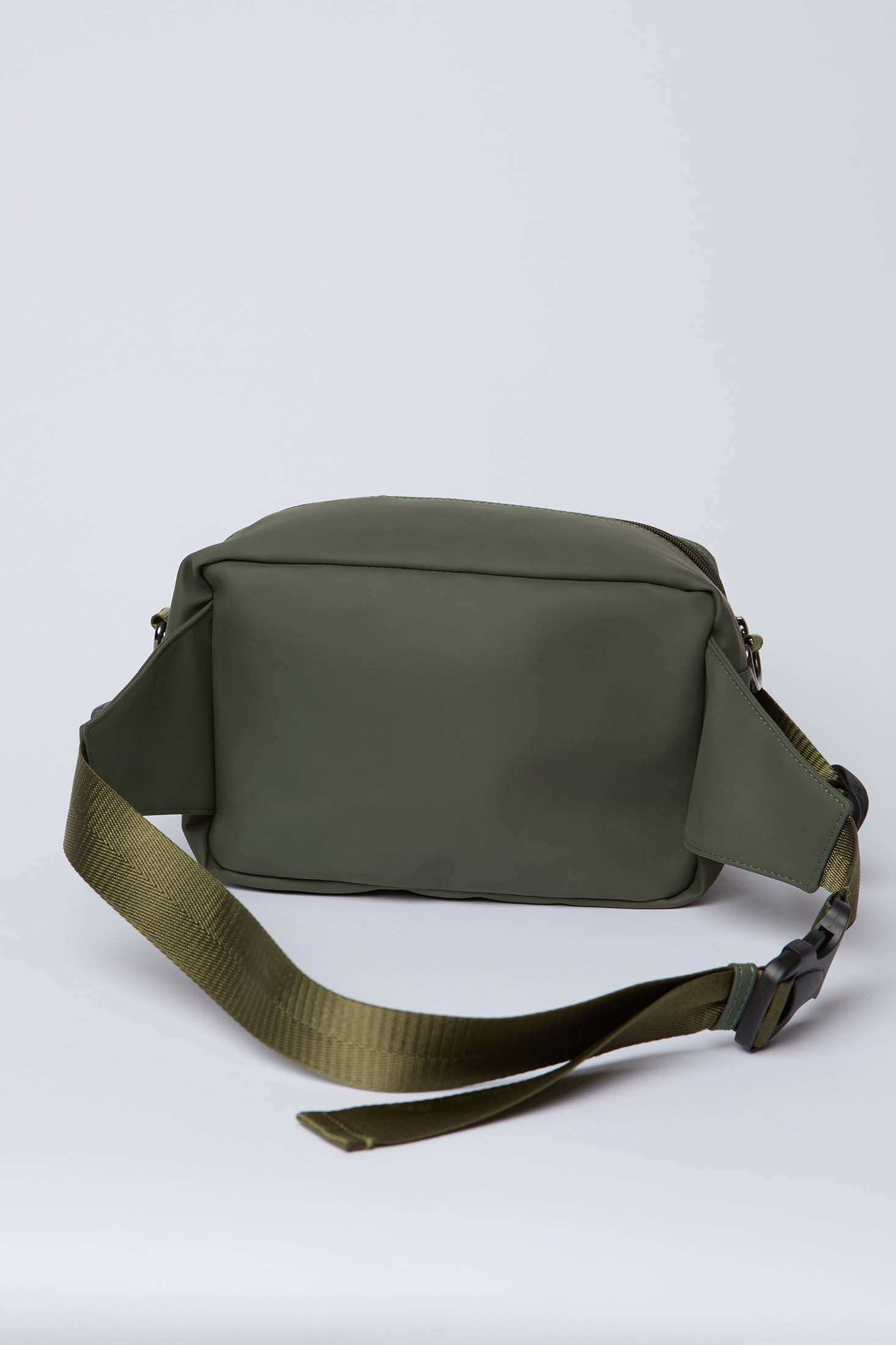 Olive green crossbody bag with adjustable strap and zip closure, minimalist design
