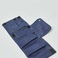 Open blue fabric organizer pouch with multiple pockets and Velcro closures on white background