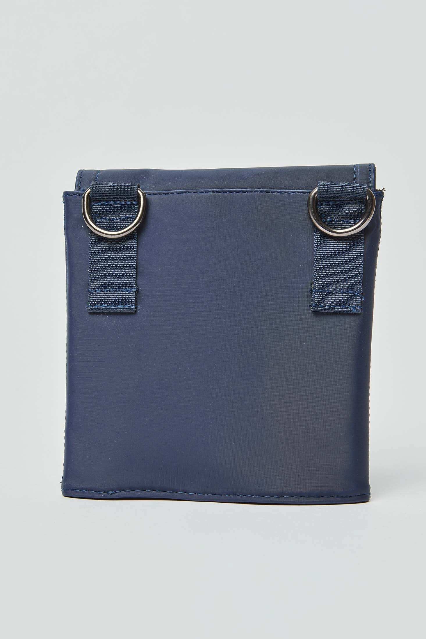 Navy blue square pouch with metal rings and fabric loops, minimalist design