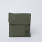Olive green square crossbody bag with stitched edges on plain background