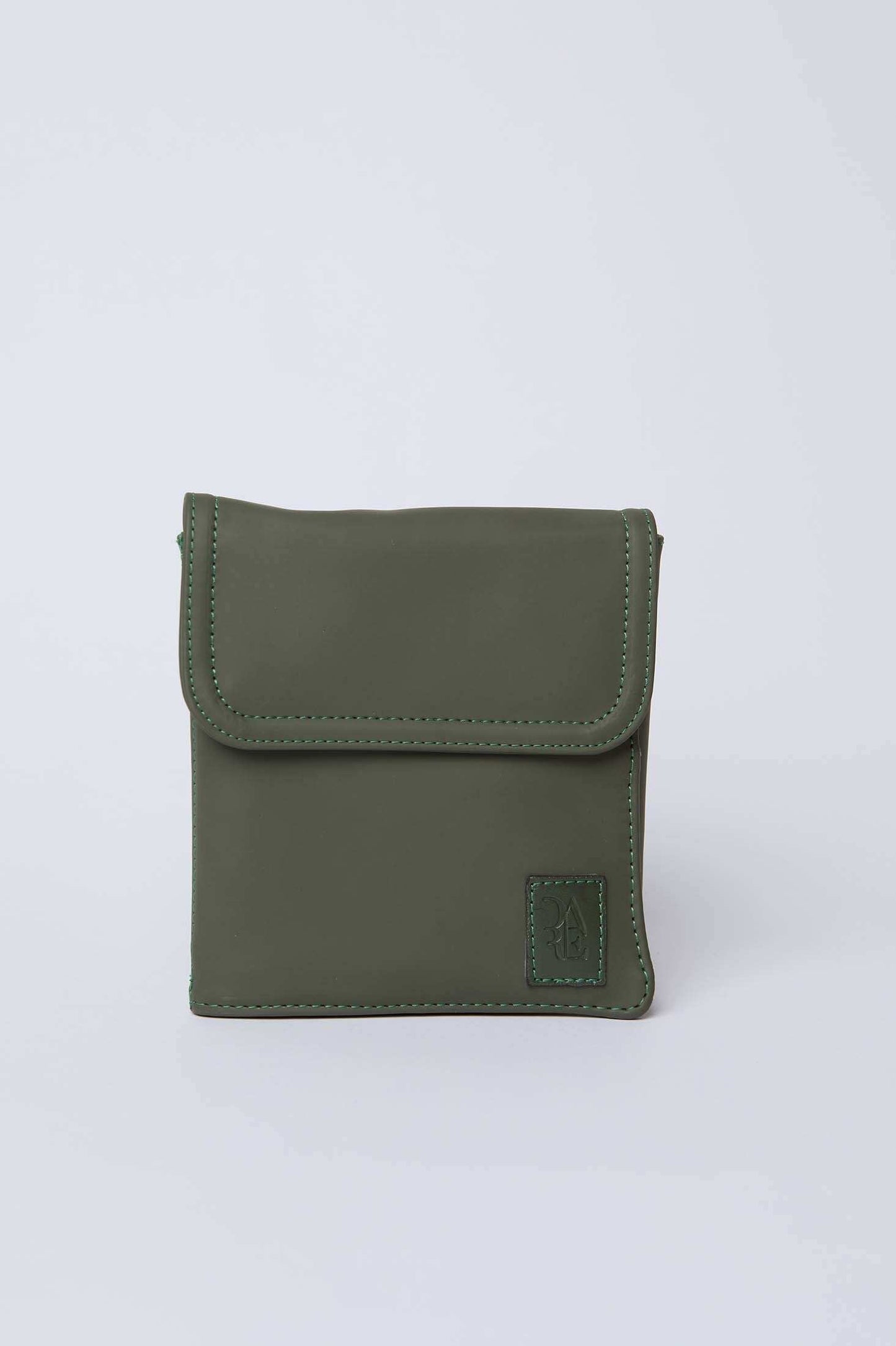 Olive green square crossbody bag with stitched edges on plain background