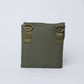 Olive green square crossbody bag with D-ring hardware, minimalist design on white background