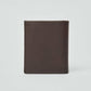 Minimalist brown leather wallet with clean stitching against plain background