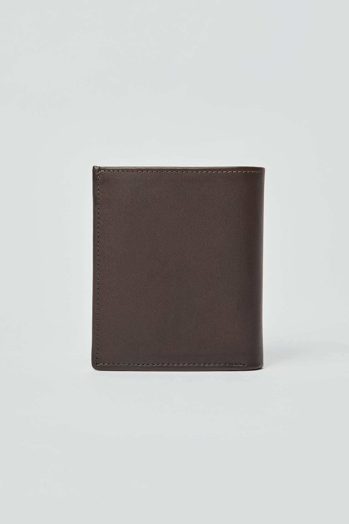 Minimalist brown leather wallet with clean stitching against plain background